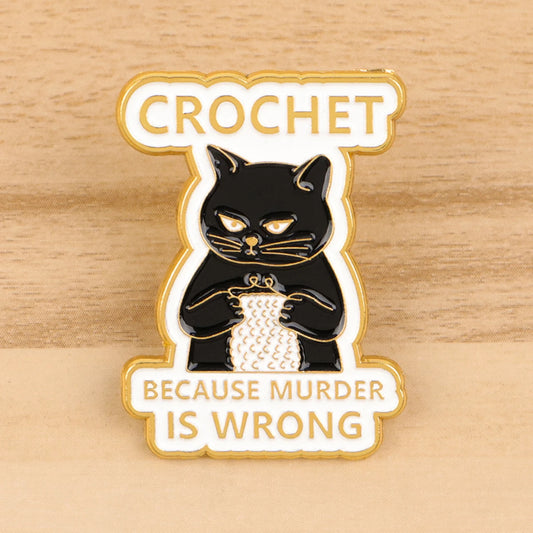 Pin with a black cat holding yarn and text 'Crochet because murder is wrong' on a wooden background